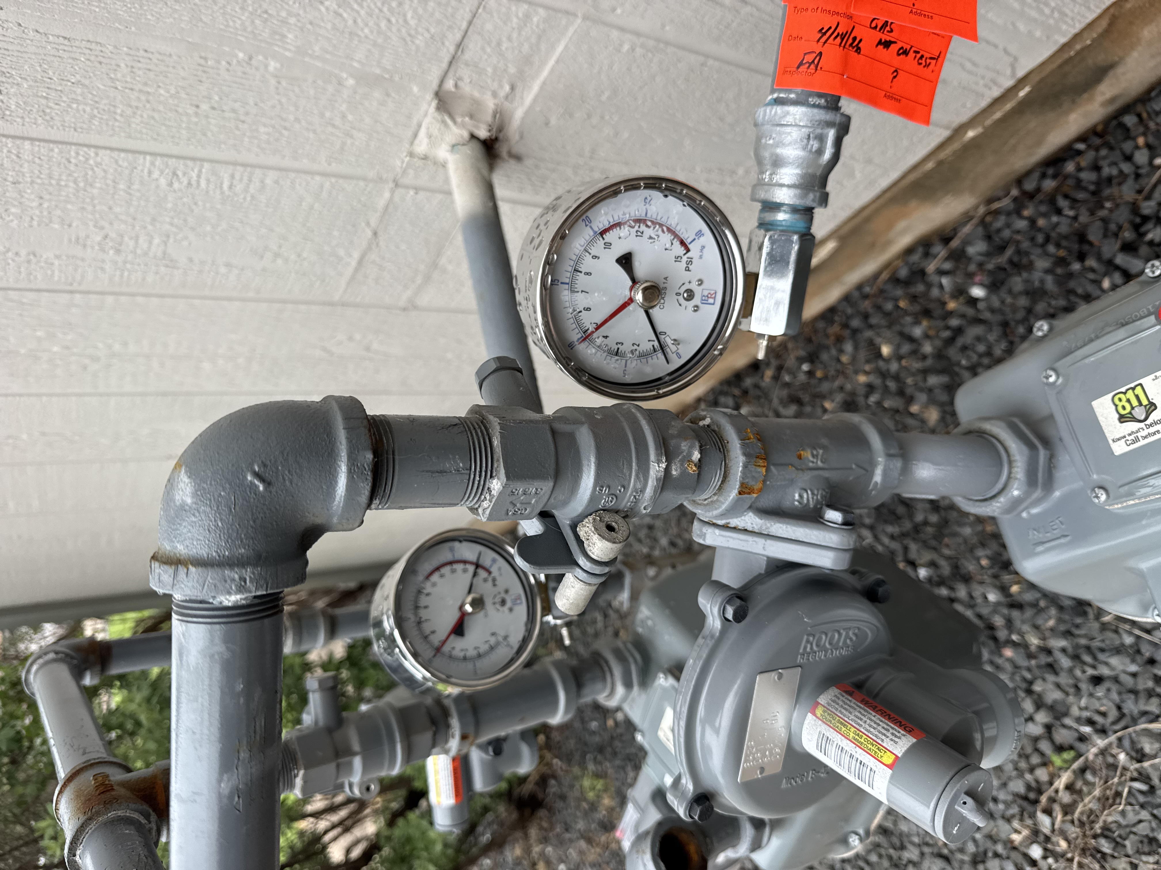 Licensed plumber working on gas line connection - Warren Brothers Plumbing serves Bastrop, Austin, and Elgin TX