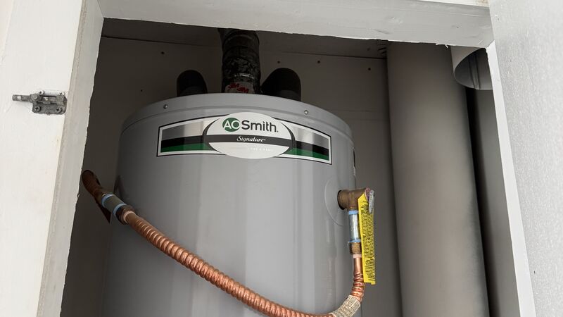 New AO Smith water heater professionally installed by Warren Brothers Plumbing in Central Texas