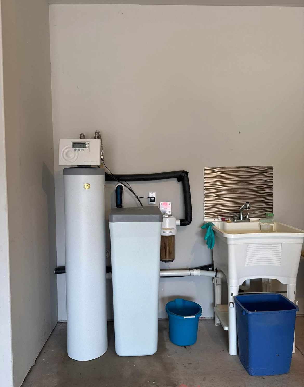 Water softener system installed in Central Texas home - Warren Brothers Plumbing serves Bastrop, Austin, and Elgin TX